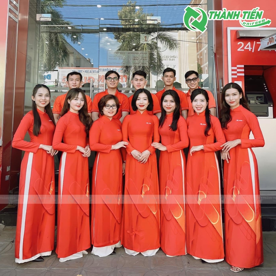 Áo dài đồng phục ngân hàng MBS màu cam thanh lịch