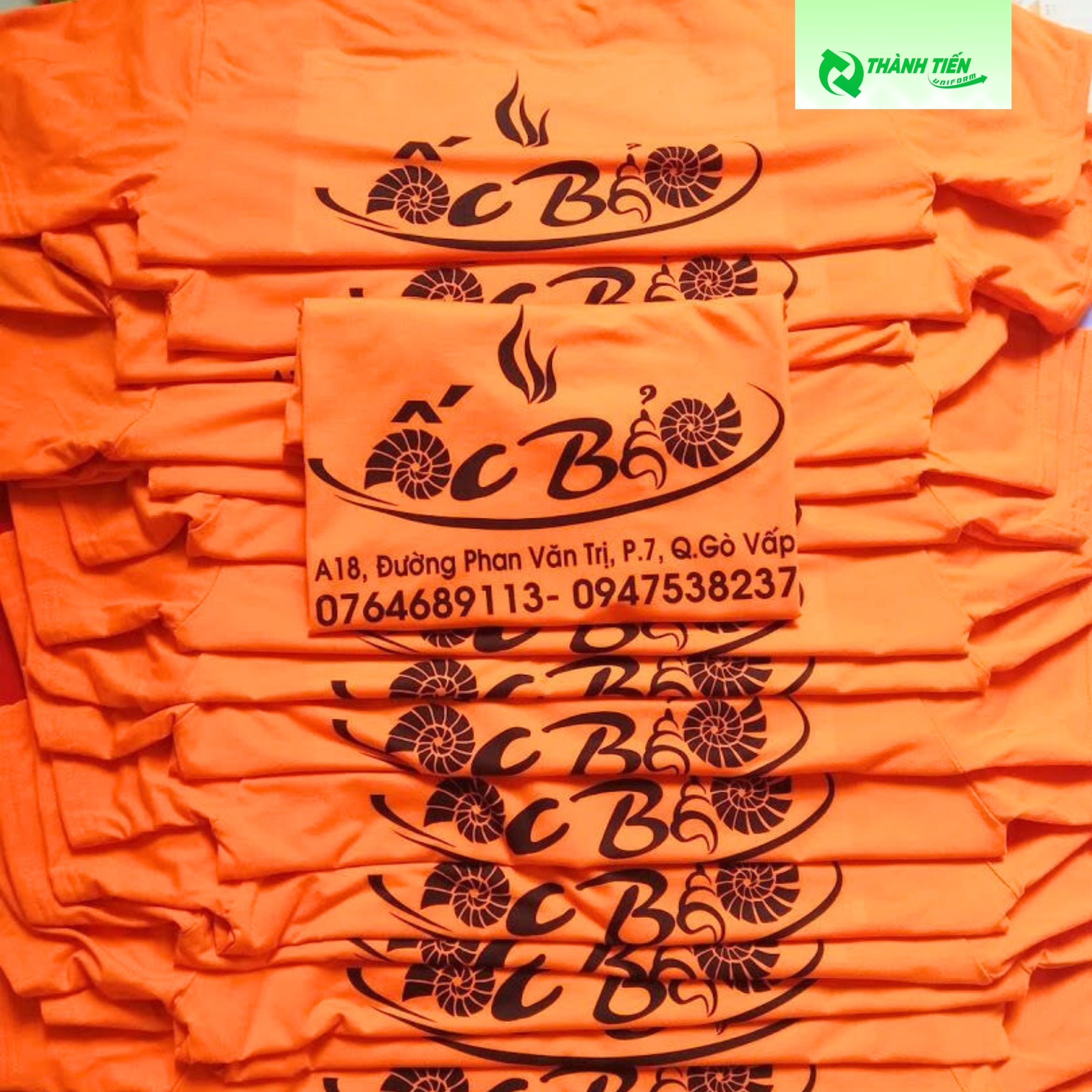 Mẫu áo cổ tròn màu cam dồng phục quán ốc giá rẻ